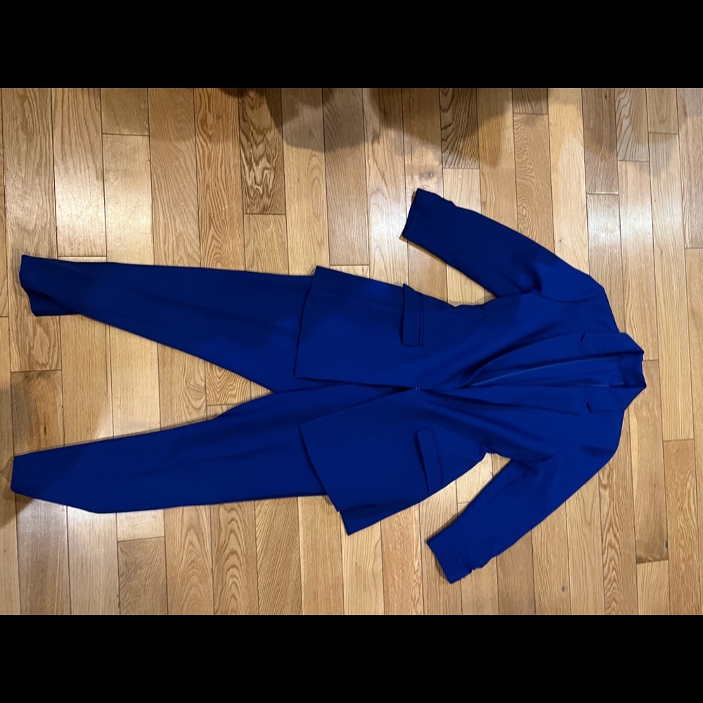 This is a blue suit comes with blazer and pants. It is an XS.